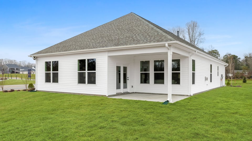 Back covered patio with large backyard.