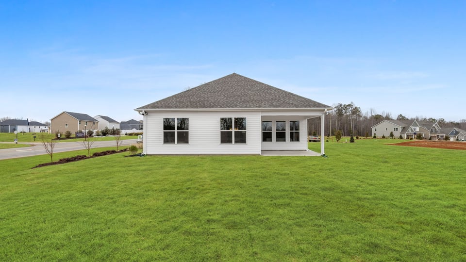 Back covered patio with large backyard.