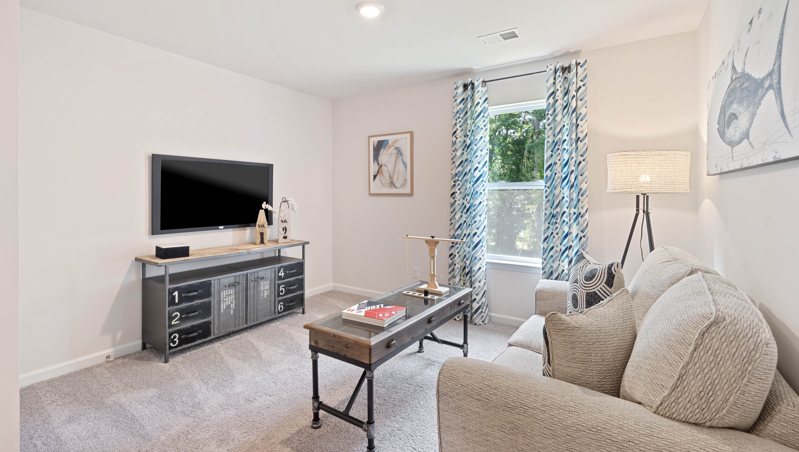 Living area with carpet and window.