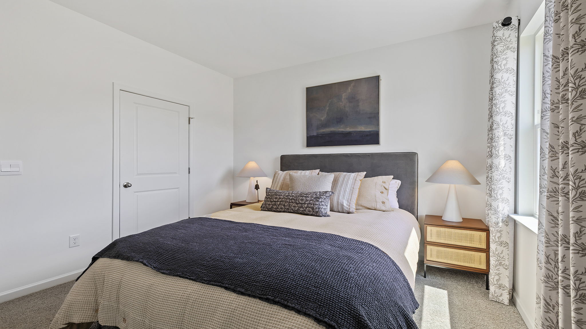 Bedroom with carpet and window.