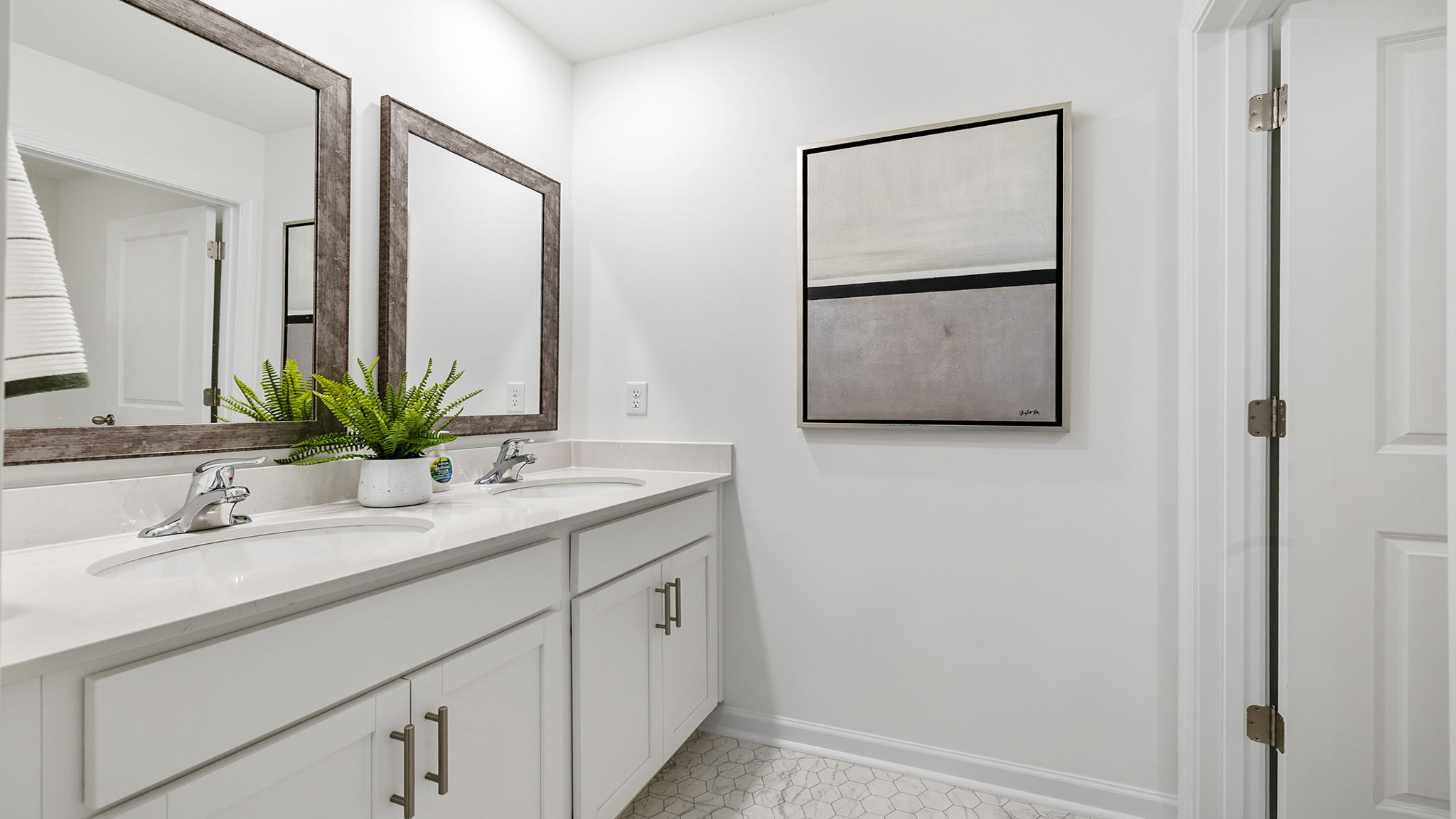 Bathroom with double vanity sinks.
