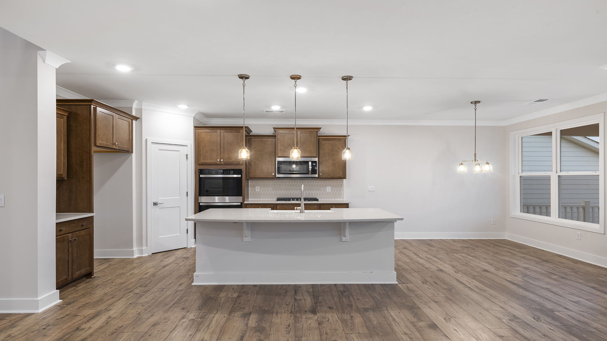View of the open kitchen and adjoining dining area.