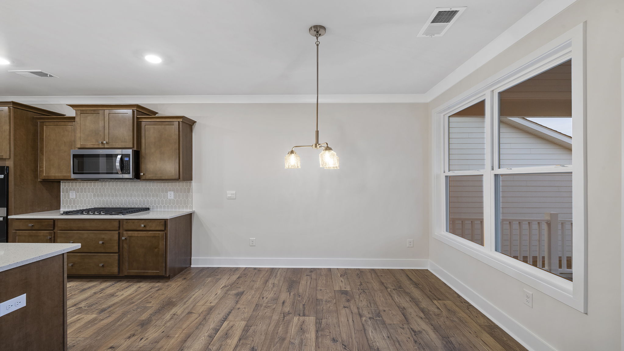 Dining area with large windows.