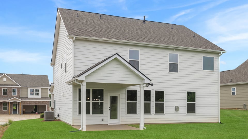 Back exterior with large backyard.