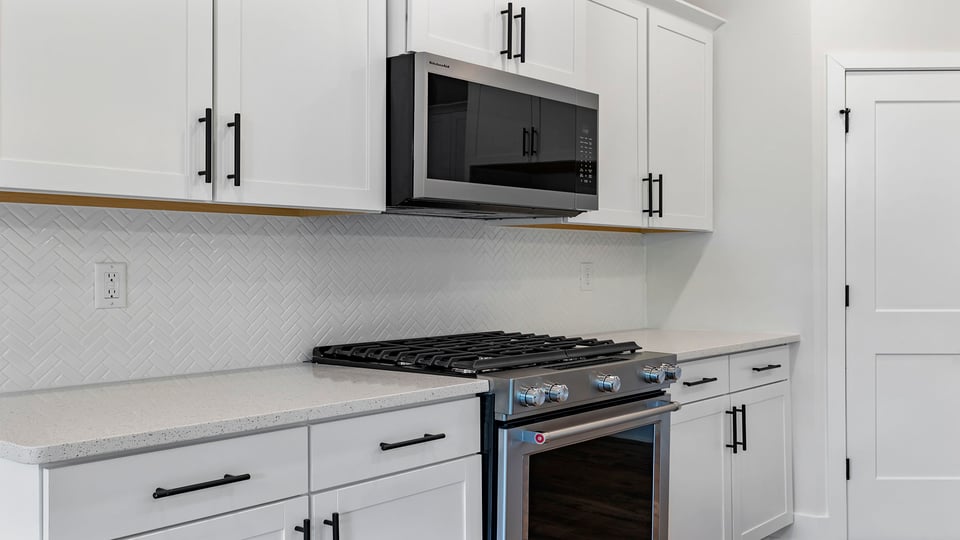 Kitchen with island and cabinets.
