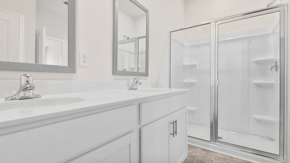Primary bathroom with double vanity sinks.