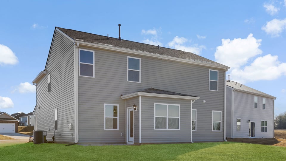 Back exterior with large backyard.