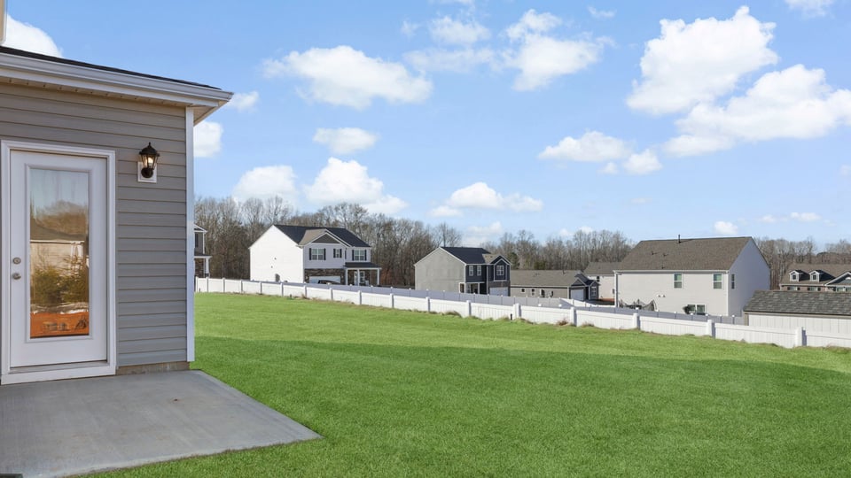 Back exterior with large backyard.