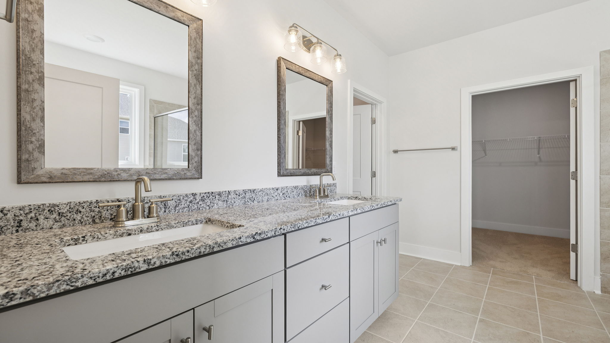 Primary bathroom with dual sink vanity.