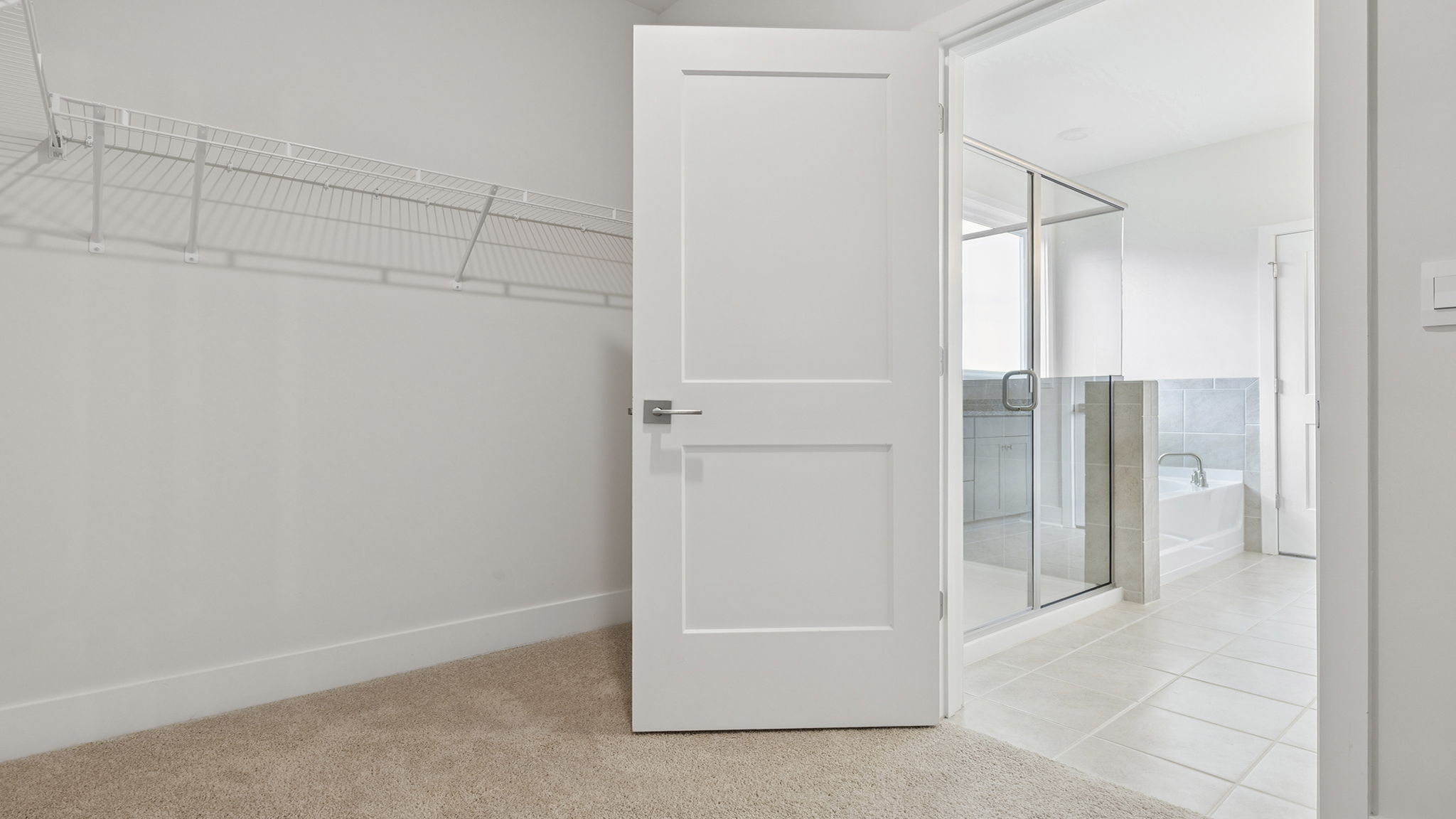 Primary bedroom walk-in closet.