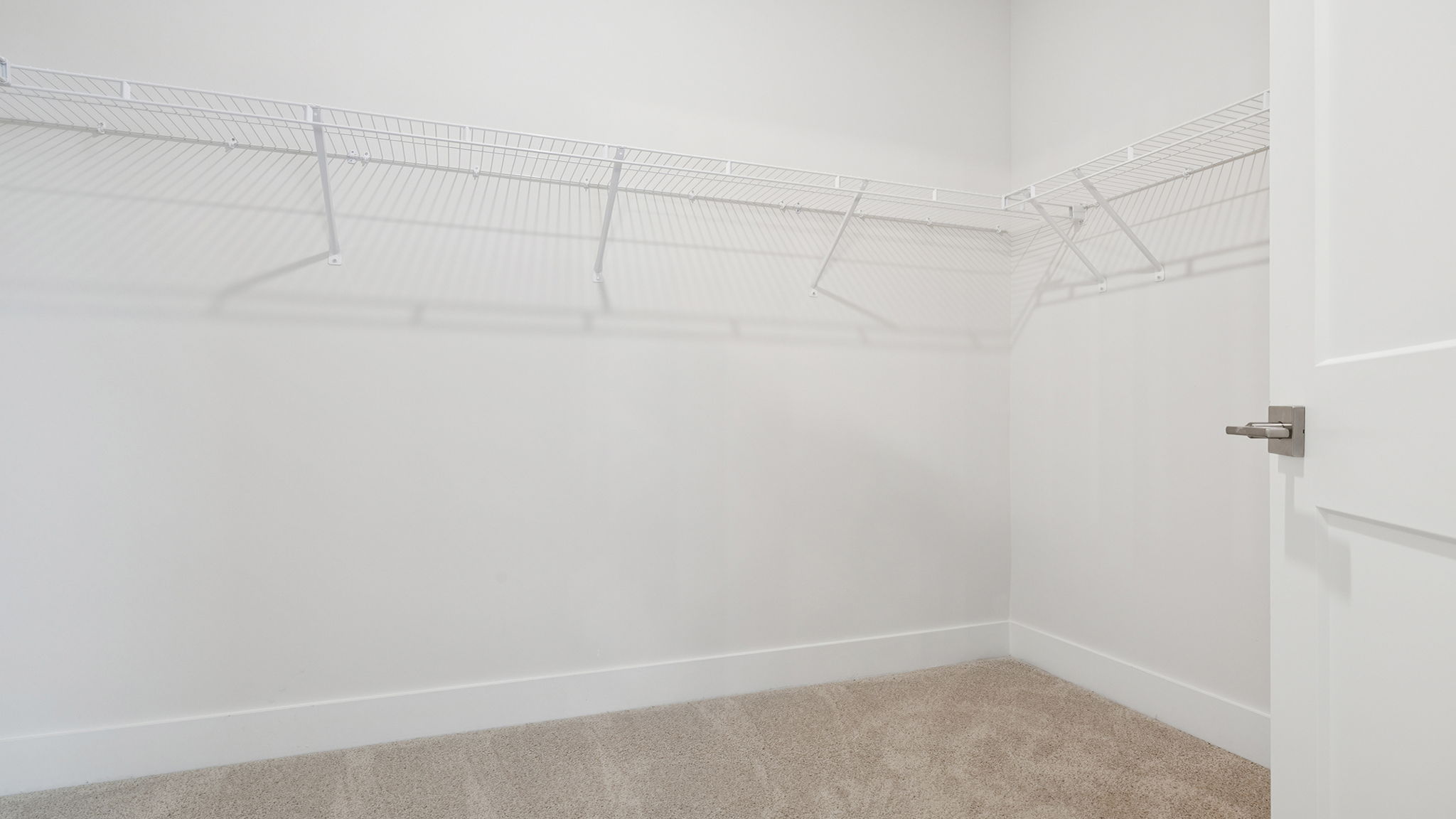 Primary bedroom walk-in closet.