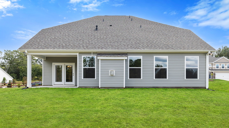 Back exterior view of the Windsor with covered porch.