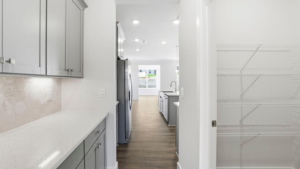 Kitchen with island and cabinets.
