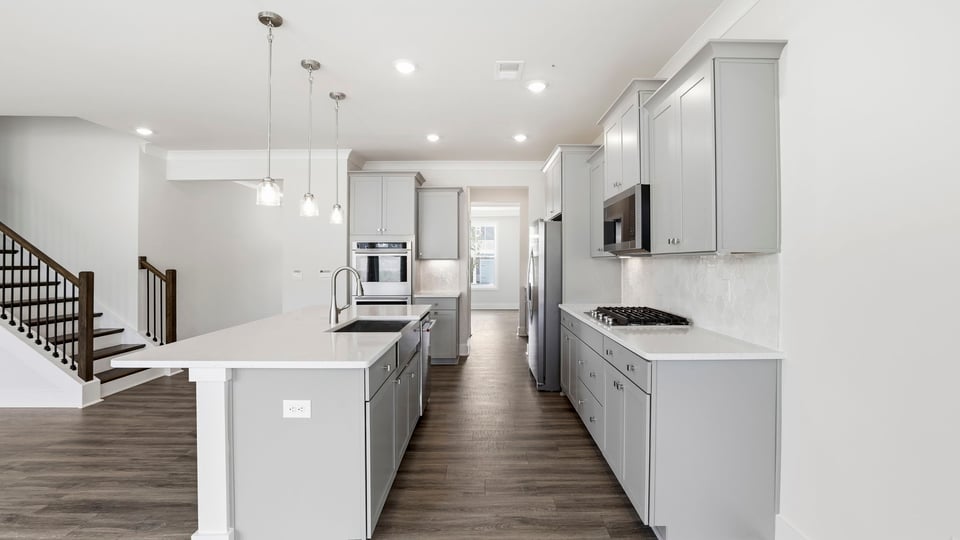 Kitchen with island and cabinets.