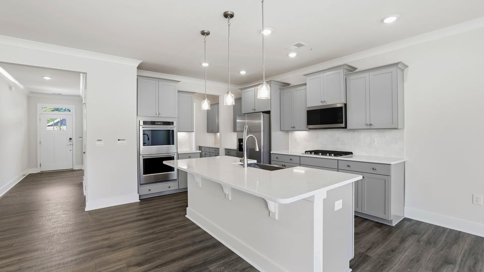 Kitchen with island and cabinets.