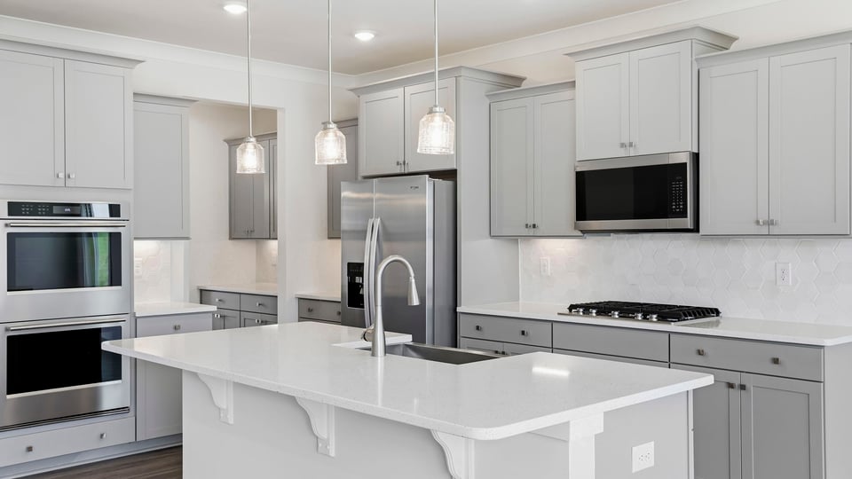Kitchen with island and cabinets.