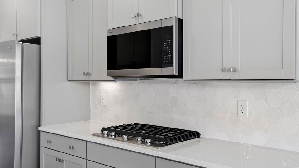 Kitchen with island and cabinets.