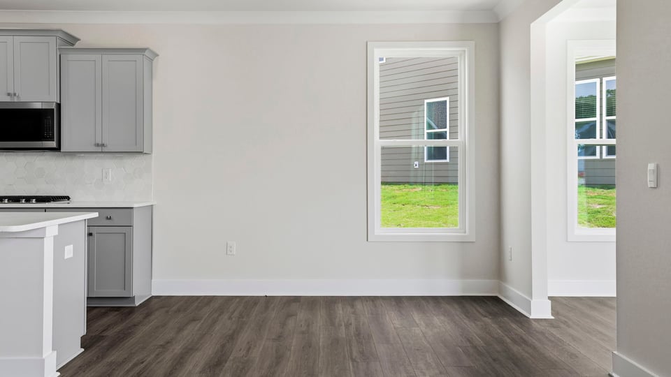 Living room with windows and fireplace.