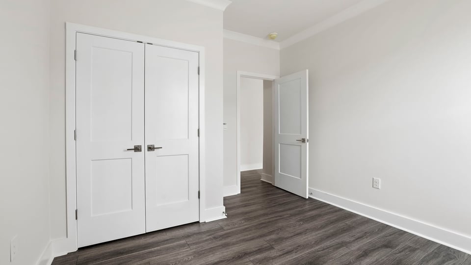 Bedroom with window and closet.
