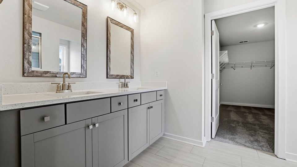 Primary bathroom with double vanity sinks.