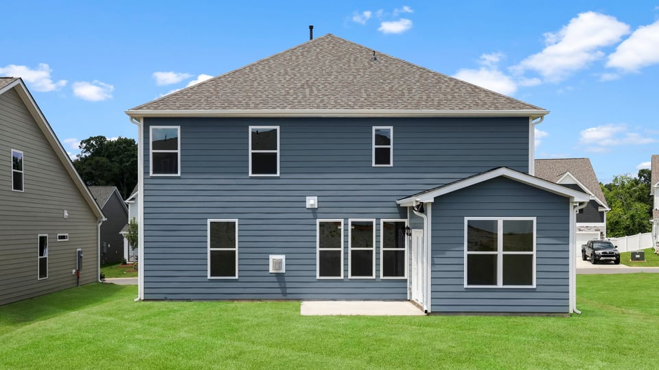 Back exterior with large backyard.