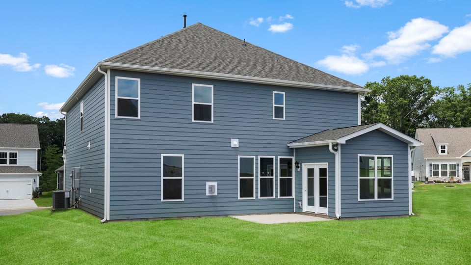 Back exterior with large backyard.