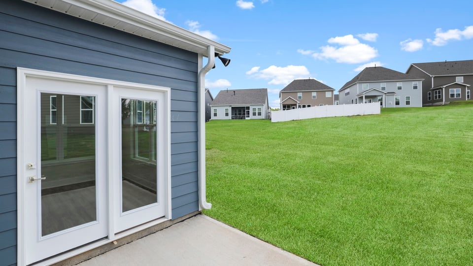 Back exterior with large backyard.