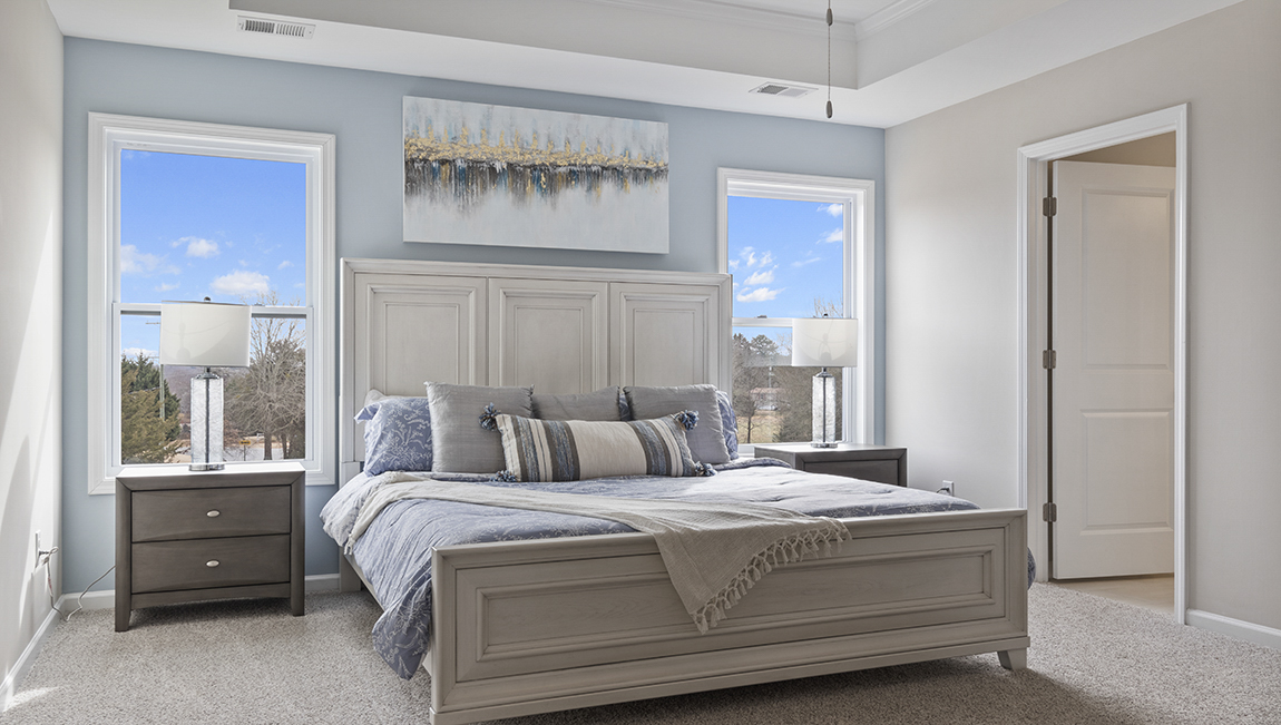 Primary bedroom with windows.