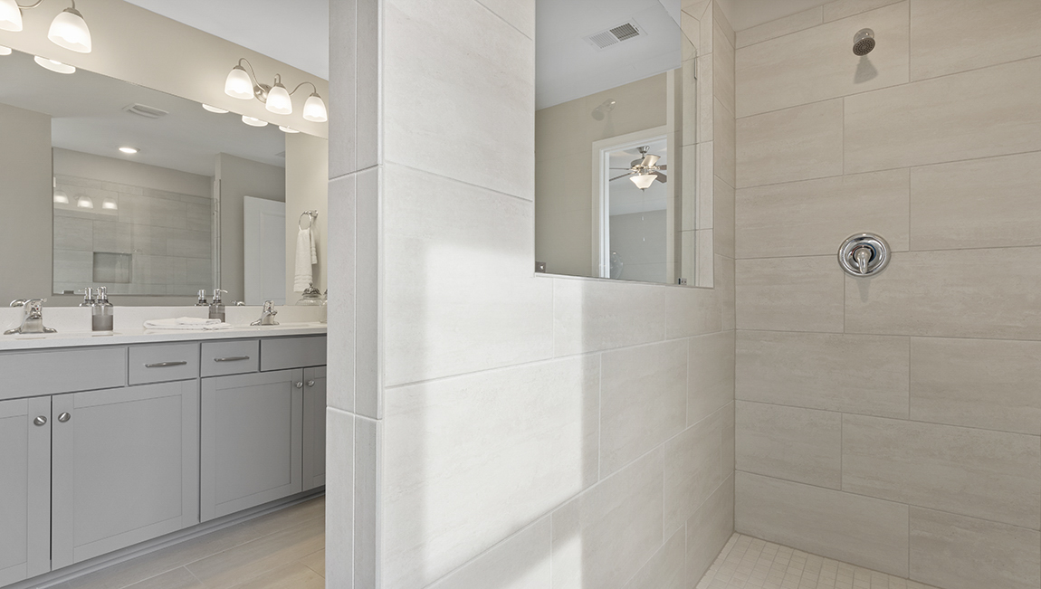 Primary bathroom with double vanity sinks.