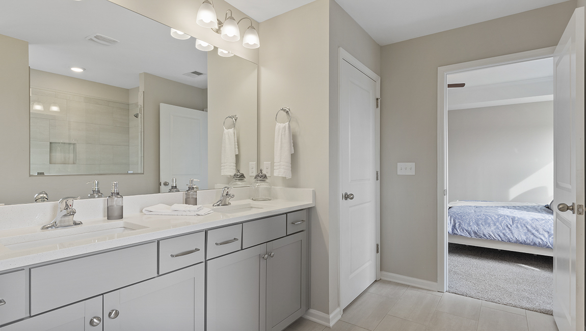 Primary bathroom with double vanity sinks.