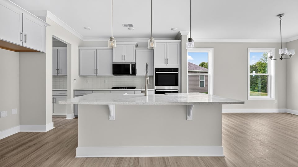 Kitchen with island and cabinets.