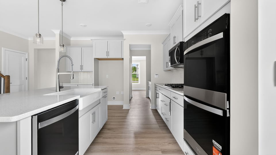 Kitchen with island and cabinets.