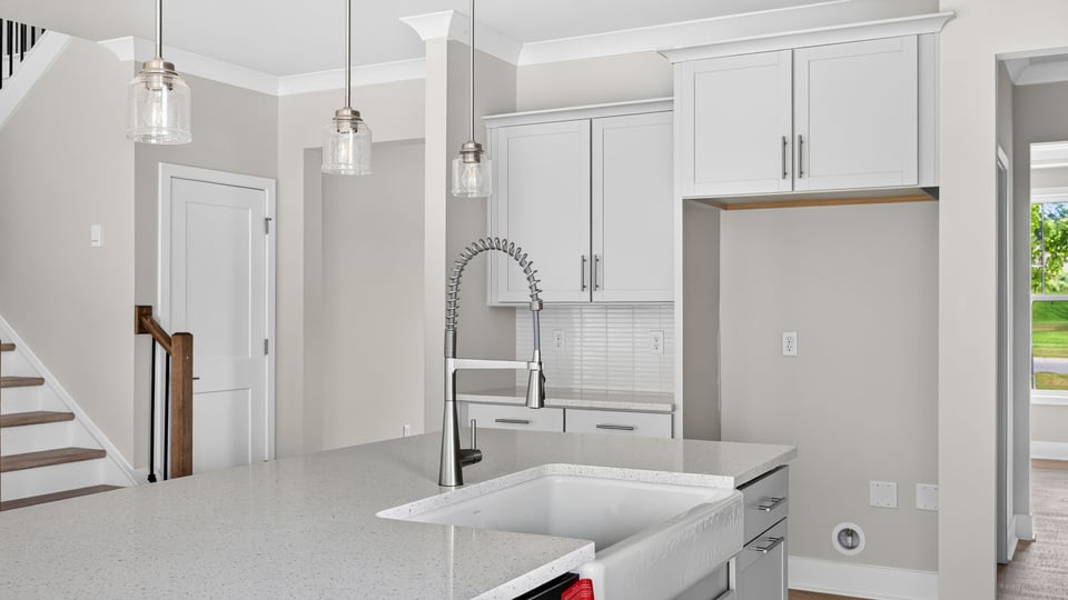 Kitchen with island and cabinets.