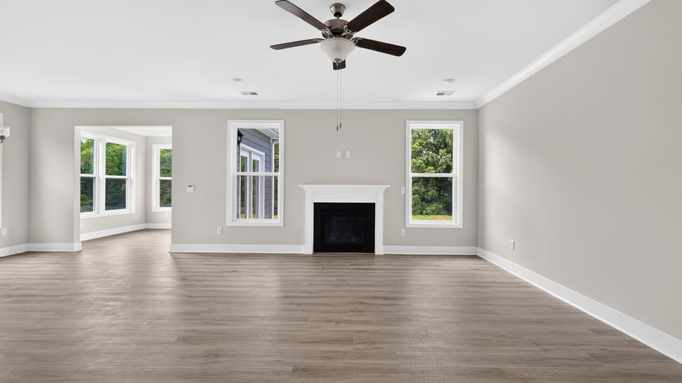 Living area with fireplace and windows.