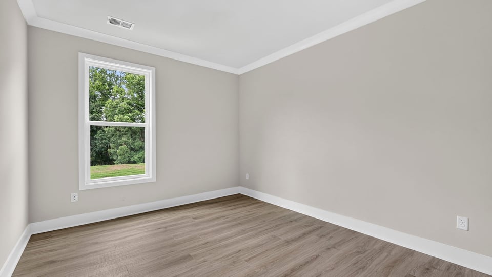 Bedroom with window and closet.
