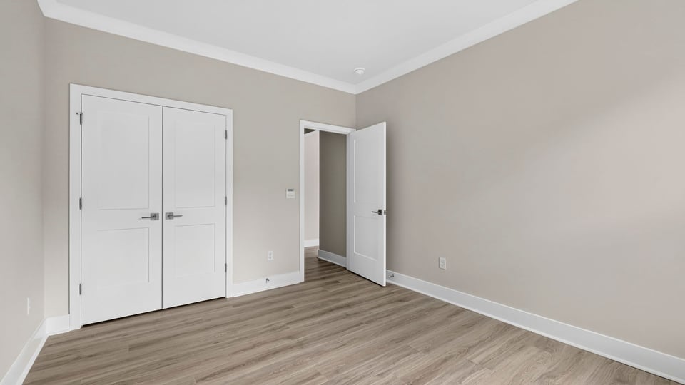 Bedroom with window and closet.