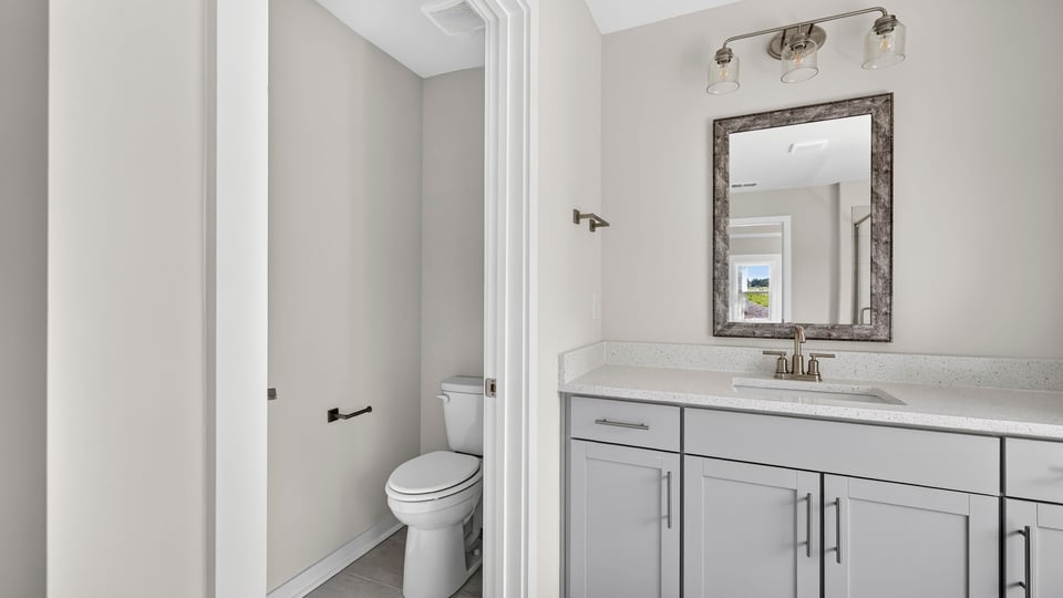 Primary bathroom with double vanity sinks.