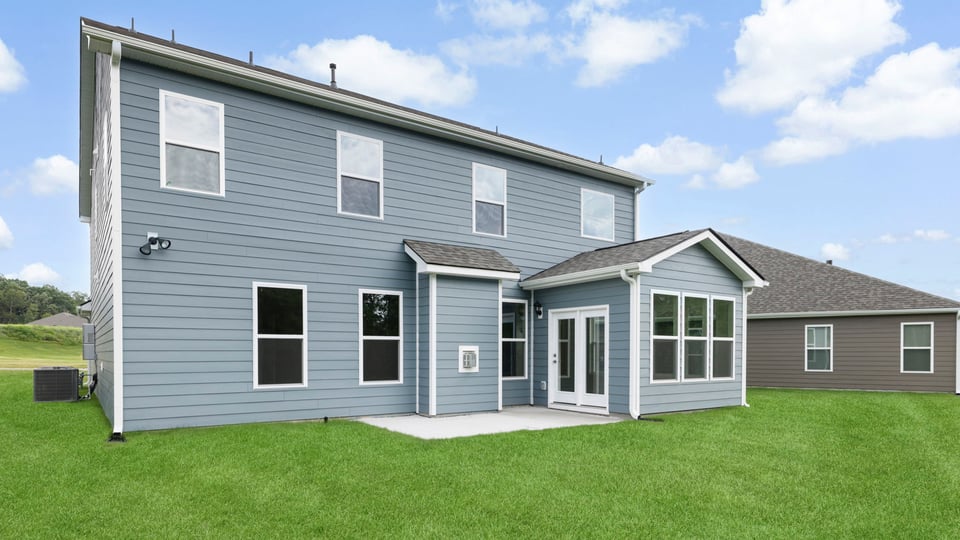 Back exterior with large backyard.