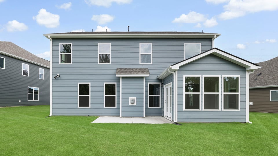 Back exterior with large backyard.