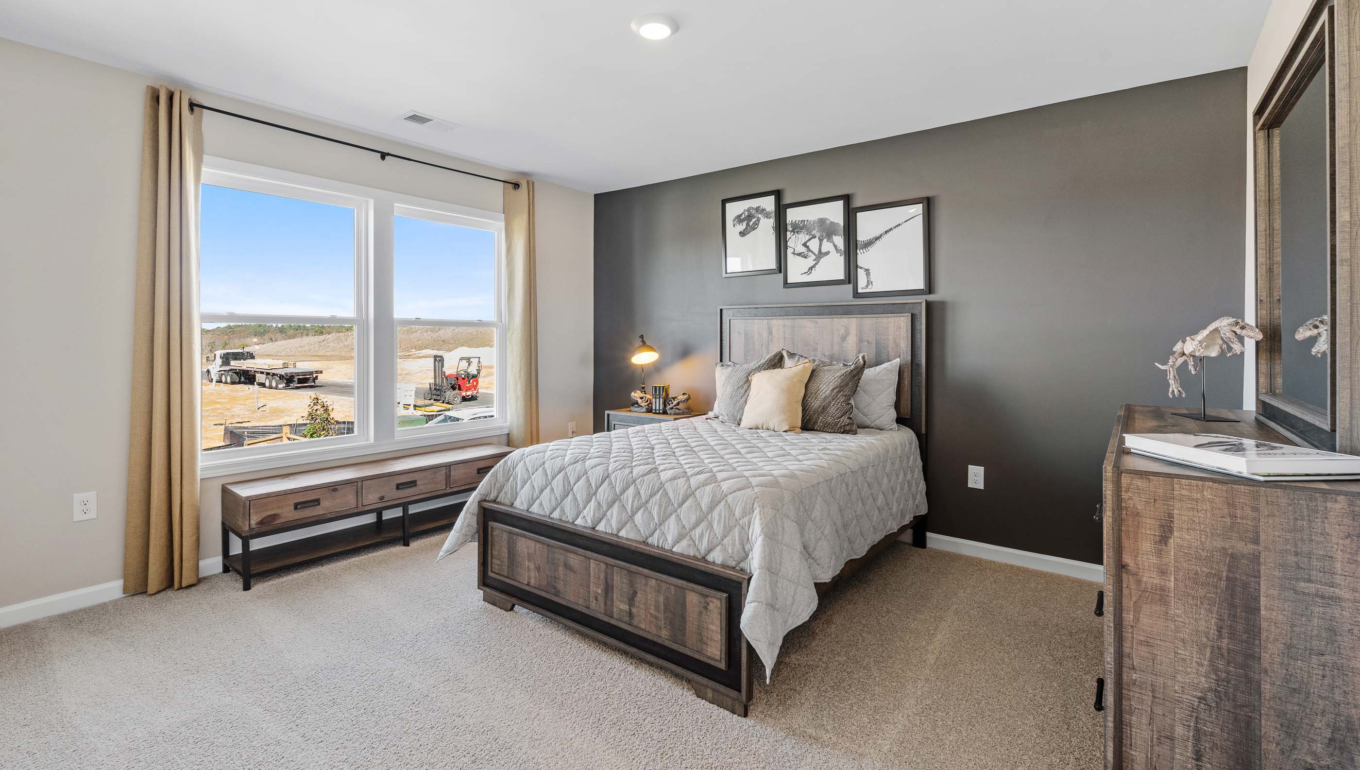 Bedroom with carpet and window.