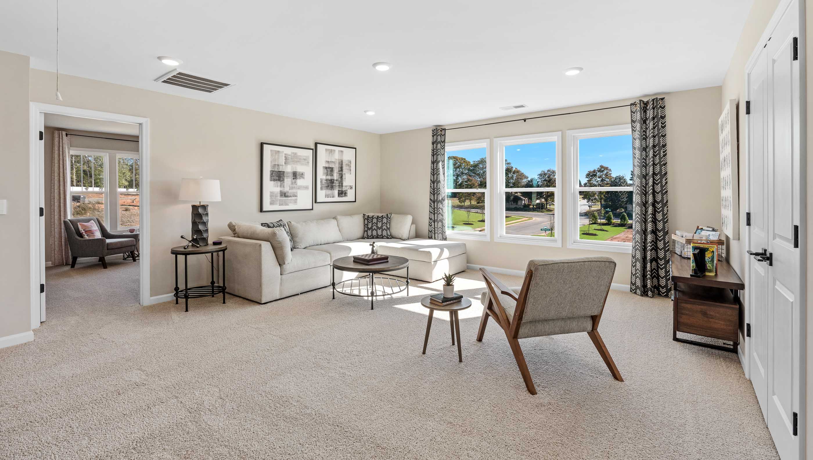 Bedroom with carpet and window.