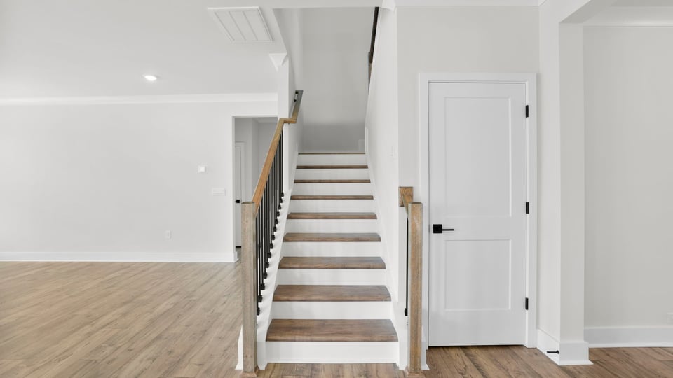 View of stairs with carpet.