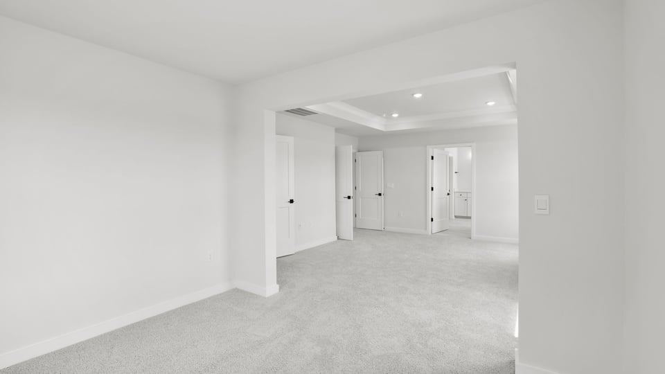 Bedroom with carpet and window.