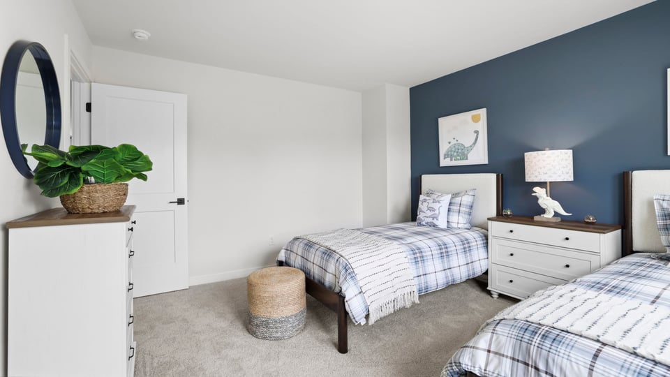 Bedroom with carpet and window.