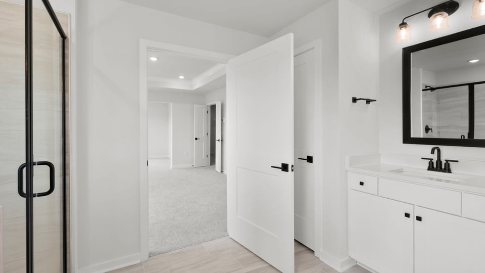 Bathroom with walk in shower and countertops.