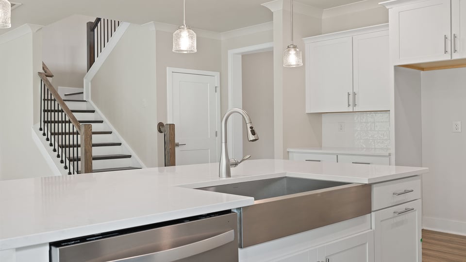Kitchen with island and cabinets.