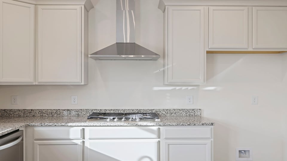 Kitchen with island and cabinets.