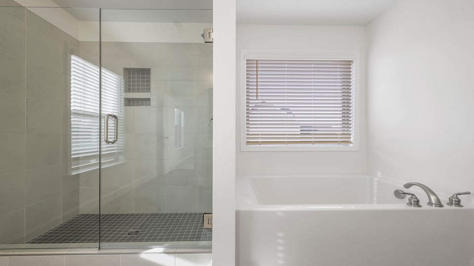 Primary bathroom with shower and tub.