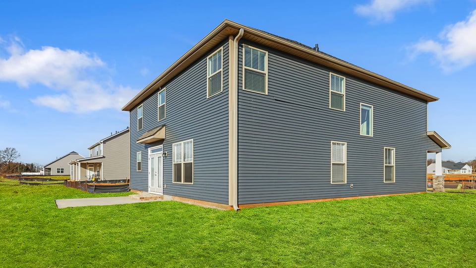 Back exterior with large backyard.