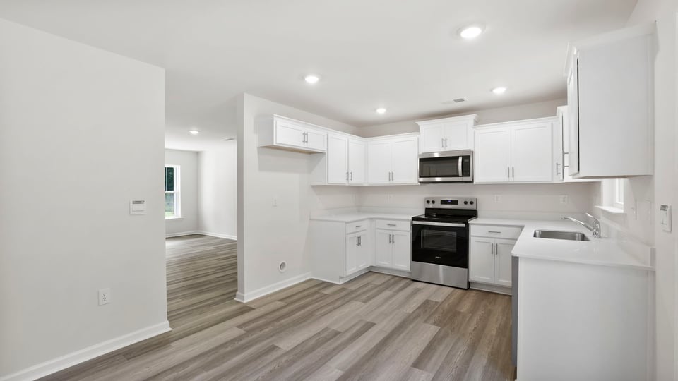 Kitchen with stainless steel appliances.